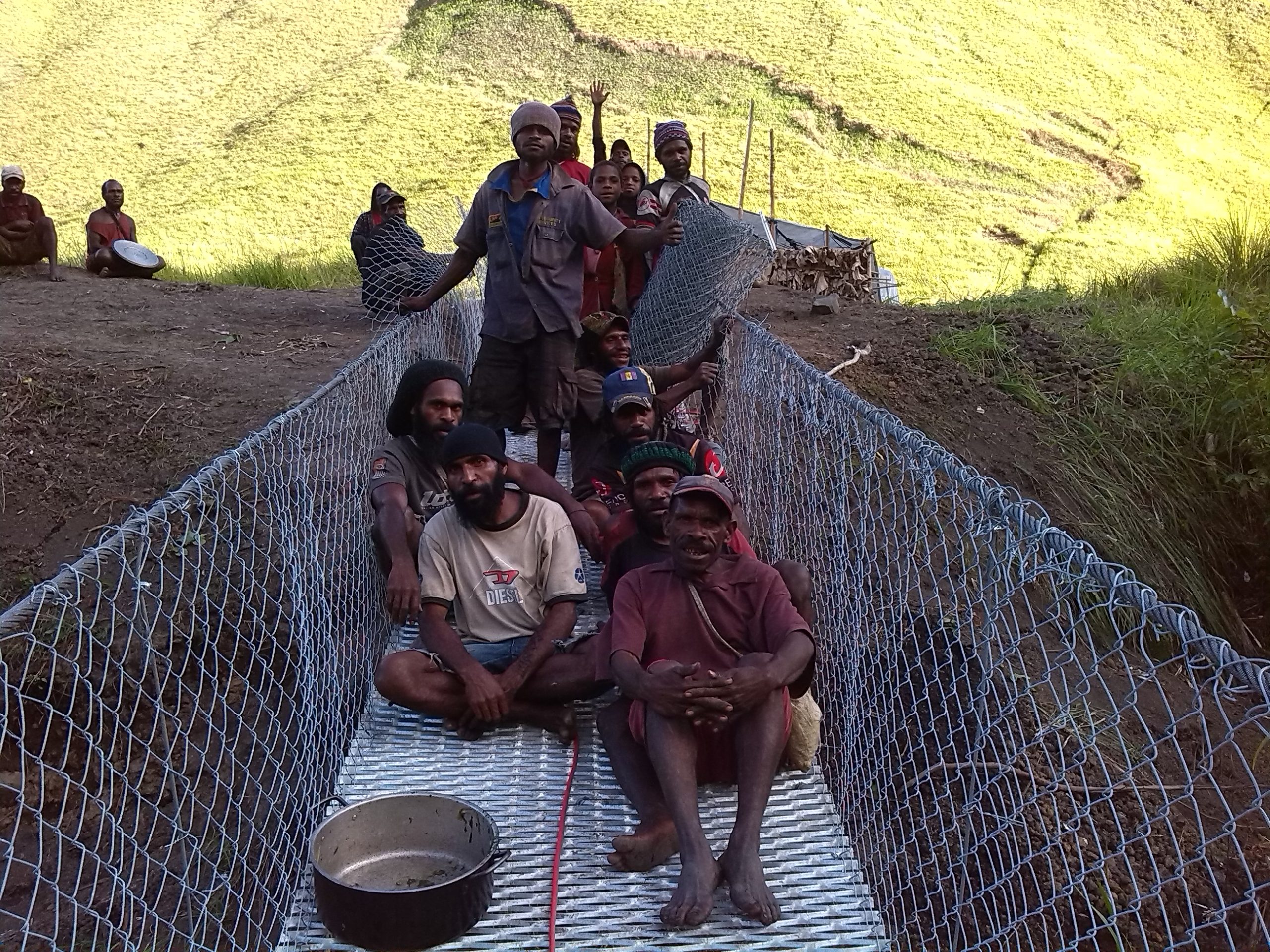 Community footbridge construction PNG